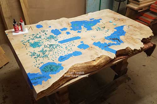turquoise placed in voids and cracks of cluster burl maple coffee table slab